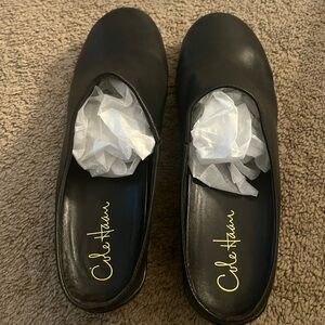 Cole Haan women’s black leather mules,